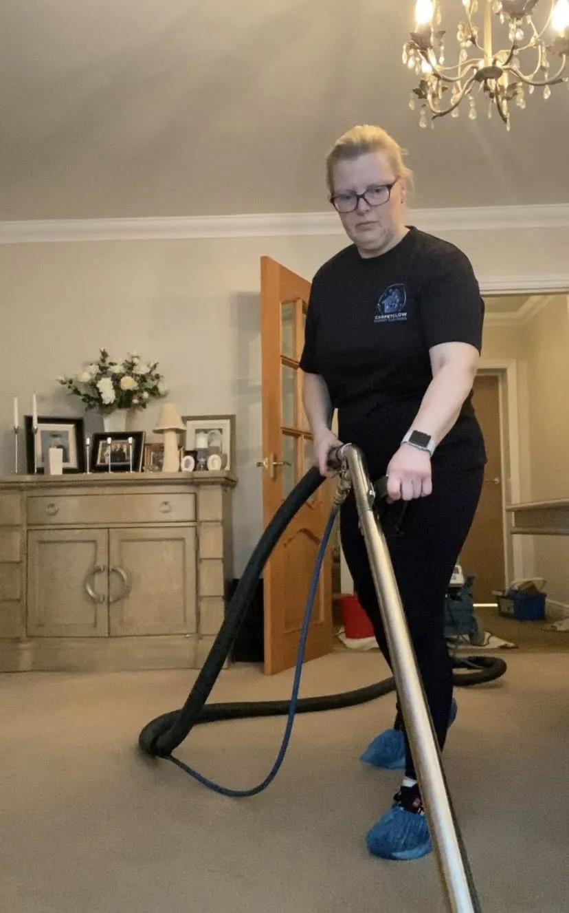 Michelle Brooks of Carpet Glow cleaning a living-room carpet in Hemel Hempstead with professional carpet cleaning equipment